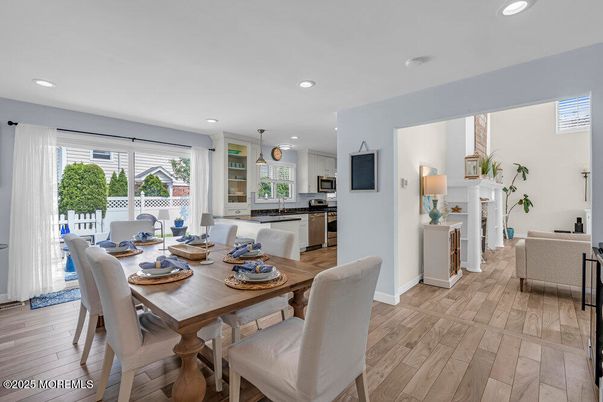 Dining room, Interior, Kitchen, Pendant Lights, Recessed Lighting, Stainless Steel Appliances, Wood Texture Flooring
