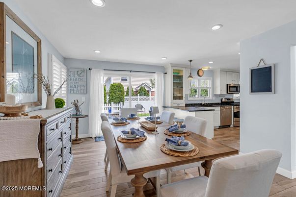 Dining room, Interior, Kitchen, Pendant Lights, Recessed Lighting, Stainless Steel Appliances, Wood Texture Flooring