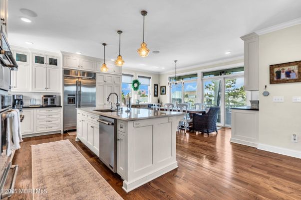 Dining room, Interior, Kitchen, Pendant Lights, Recessed Lighting, Stainless Steel Appliances, Wood Texture Flooring