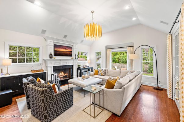 Chandelier, Fireplace, Interior, Living room, Pendant Lights, Recessed Lighting, Wood Texture Flooring