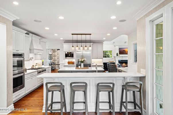 Fireplace, Interior, Kitchen, Pendant Lights, Recessed Lighting, Stainless Steel Appliances, Wood Texture Flooring