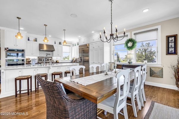 Chandelier, Dining room, Interior, Kitchen, Pendant Lights, Recessed Lighting, Stainless Steel Appliances, Wood Texture Flooring
