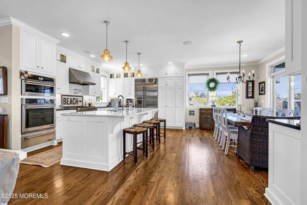 Dining room, Interior, Kitchen, Pendant Lights, Recessed Lighting, Stainless Steel Appliances, Wood Texture Flooring