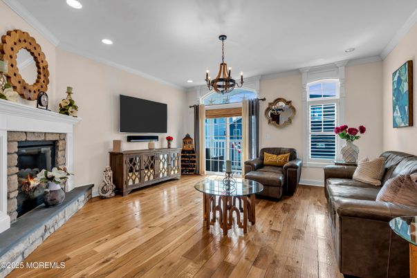 Chandelier, Fireplace, Interior, Living room, Recessed Lighting, Wood Texture Flooring