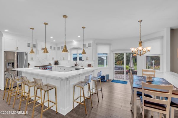 Chandelier, Dining room, Interior, Kitchen, Pendant Lights, Recessed Lighting, Stainless Steel Appliances, Wood Texture Flooring