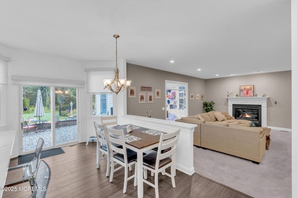 Chandelier, Dining room, Fireplace, Interior, Living room, Recessed Lighting, Wood Texture Flooring