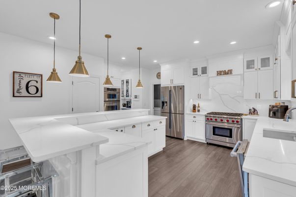 Interior, Kitchen, Marble Walls, Pendant Lights, Recessed Lighting, Stainless Steel Appliances, Wood Texture Flooring