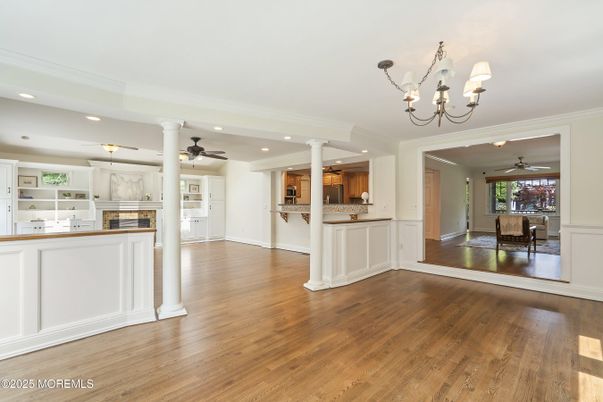 Chandelier, Dining room, Empty room, Fireplace, Interior, Kitchen, Recessed Lighting, Wood Texture Flooring