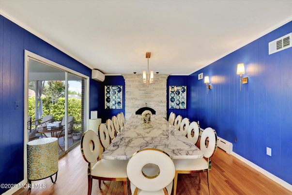 Dining room, Fireplace, Interior, Pendant Lights, Stone Walls, Wood Texture Flooring