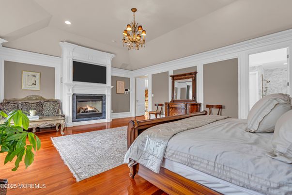 Bedroom, Chandelier, Fireplace, Interior, Recessed Lighting, Wood Texture Flooring
