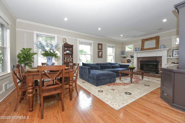 Dining room, Fireplace, Interior, Living room, Recessed Lighting, Wood Texture Flooring