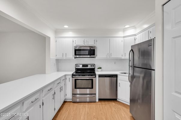 Interior, Kitchen, Recessed Lighting, Stainless Steel Appliances, Wood Texture Flooring