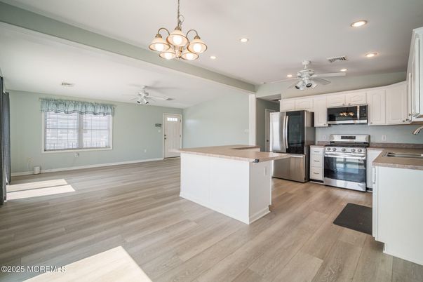 Chandelier, Interior, Kitchen, Recessed Lighting, Stainless Steel Appliances, Wood Texture Flooring