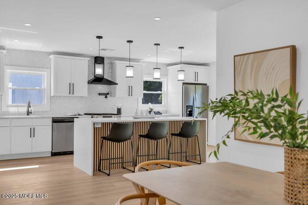 Interior, Kitchen, Pendant Lights, Recessed Lighting, Stainless Steel Appliances, Wood Texture Flooring