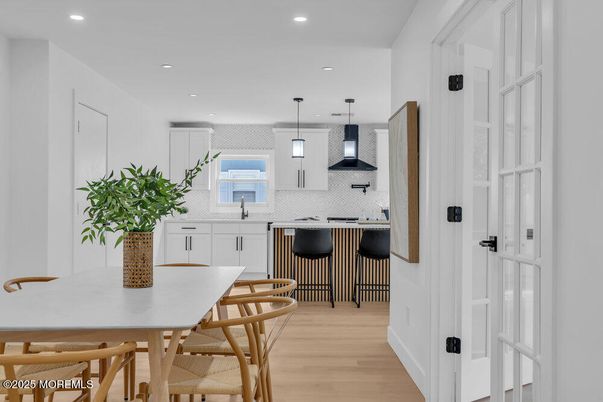 Dining room, Interior, Kitchen, Pendant Lights, Recessed Lighting, Stainless Steel Appliances, Wood Texture Flooring