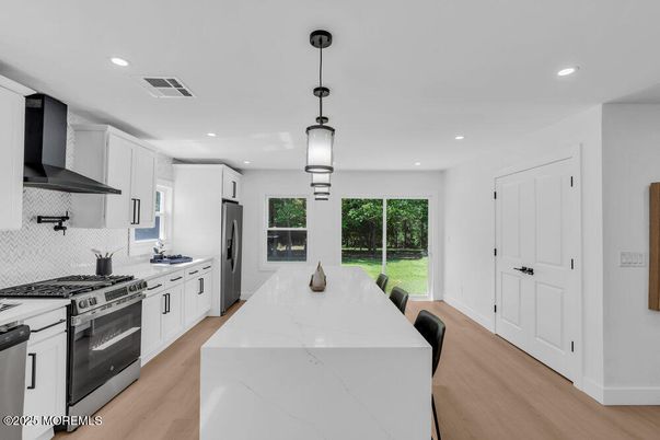 Interior, Kitchen, Pendant Lights, Recessed Lighting, Stainless Steel Appliances, Wood Texture Flooring