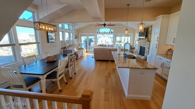 Dining room, Fireplace, Interior, Kitchen, Living room, Pendant Lights, Wood Texture Flooring