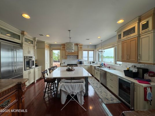 Dining room, Interior, Kitchen, Pendant Lights, Recessed Lighting, Stainless Steel Appliances, Water, Wood Texture Flooring