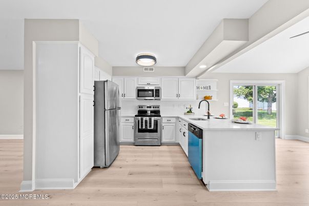 Interior, Kitchen, Recessed Lighting, Stainless Steel Appliances, Wood Texture Flooring