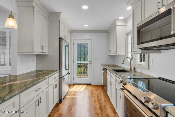 Interior, Kitchen, Pendant Lights, Recessed Lighting, Stainless Steel Appliances, Wood Texture Flooring