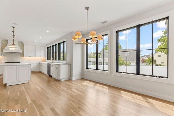 Interior, Kitchen, Marble Walls, Pendant Lights, Recessed Lighting, Wood Texture Flooring