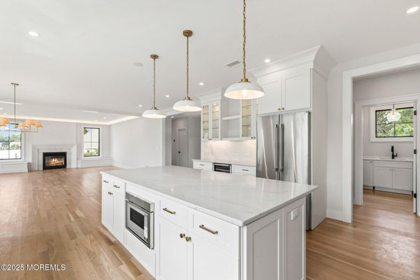 Fireplace, Interior, Kitchen, Pendant Lights, Recessed Lighting, Stainless Steel Appliances, Wood Texture Flooring