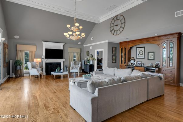 Chandelier, Fireplace, Interior, Living room, Pendant Lights, Recessed Lighting, Wood Texture Flooring