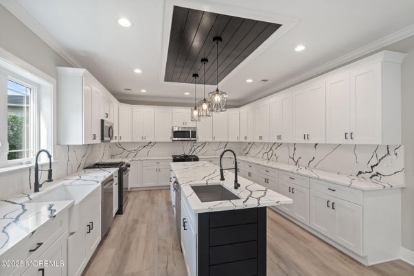 Interior, Kitchen, Marble Walls, Pendant Lights, Recessed Lighting, Stainless Steel Appliances, Wood Texture Flooring