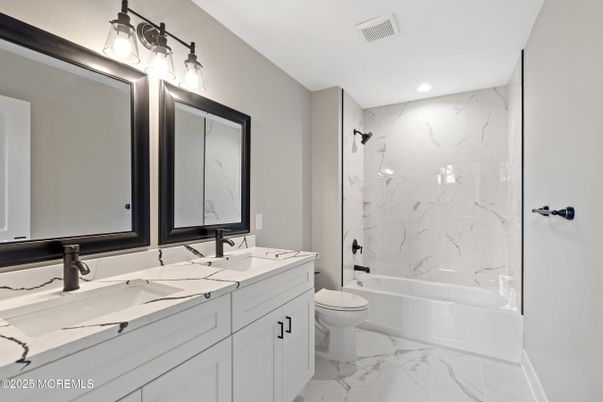 Bathroom, Dual Sink Vanities, Glass Shower, Interior, Marble, Marble Walls, Recessed Lighting