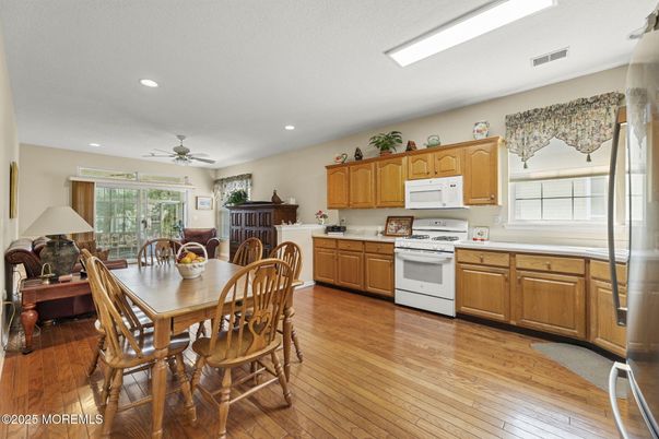 Dining room, Interior, Kitchen, Recessed Lighting, Stainless Steel Appliances, Wood Texture Flooring