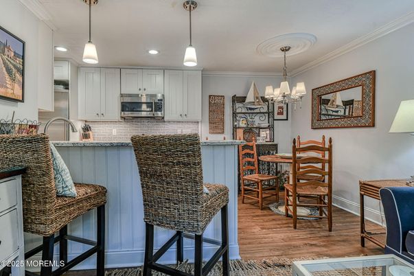Chandelier, Dining room, Interior, Kitchen, Pendant Lights, Recessed Lighting, Stainless Steel Appliances, Wood Texture Flooring