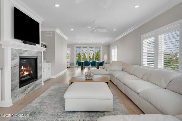 Dining room, Fireplace, Interior, Living room, Recessed Lighting, Wood Texture Flooring
