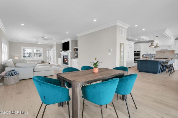Dining room, Fireplace, Interior, Kitchen, Living room, Pendant Lights, Recessed Lighting, Stainless Steel Appliances, Wood Texture Flooring
