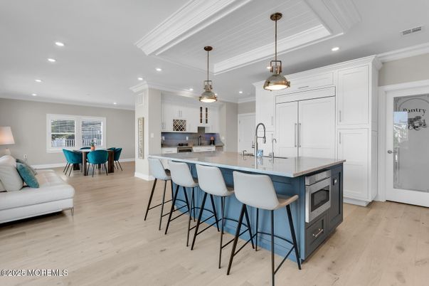 Dining room, Interior, Kitchen, Pendant Lights, Recessed Lighting, Stainless Steel Appliances, Wood Texture Flooring
