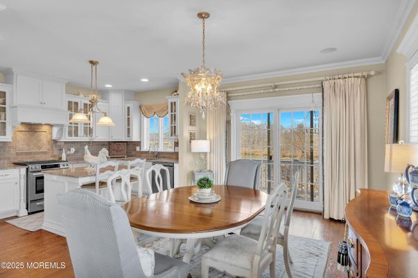 Chandelier, Dining room, Interior, Kitchen, Pendant Lights, Recessed Lighting, Stainless Steel Appliances, Wood Texture Flooring