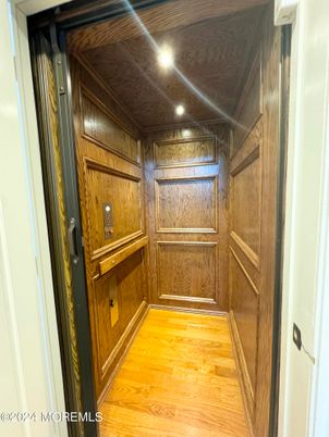 Elevator, Interior, Recessed Lighting, Wooden Ceilings, Wood Texture Flooring, Wooden Walls