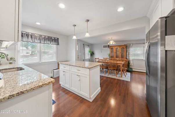 Dining room, Interior, Kitchen, Pendant Lights, Recessed Lighting, Stainless Steel Appliances, Wood Texture Flooring
