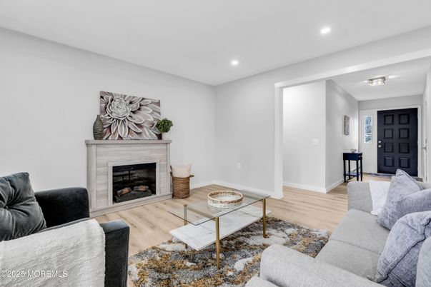 Fireplace, Interior, Living room, Recessed Lighting, Wood Texture Flooring