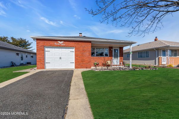 Attached, Exterior, Facade, Brick Facade, Solar Panels, Split Level