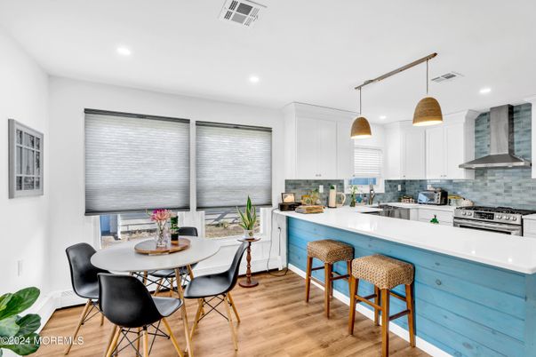 Dining room, Interior, Kitchen, Pendant Lights, Recessed Lighting, Stainless Steel Appliances, Wood Texture Flooring
