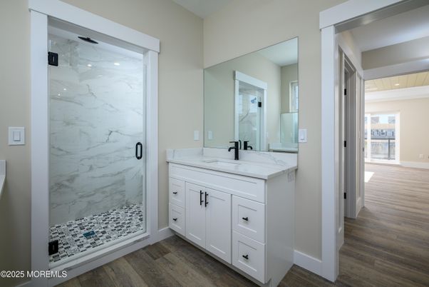 Bathroom, Glass Shower, Interior, Marble Walls, Recessed Lighting, Wood Texture Flooring