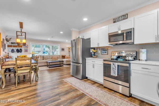 Dining room, Interior, Kitchen, Living room, Pendant Lights, Recessed Lighting, Stainless Steel Appliances, Wood Texture Flooring