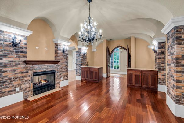 Chandelier, Empty room, Fireplace, Interior, Stone Walls, Wood Texture Flooring