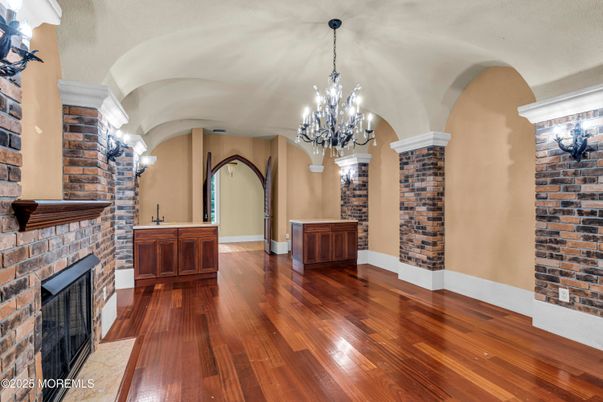 Chandelier, Empty room, Fireplace, Interior, Stone Walls, Wood Texture Flooring