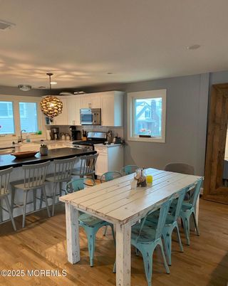 Dining room, Interior, Kitchen, Pendant Lights, Stainless Steel Appliances, Wood Texture Flooring