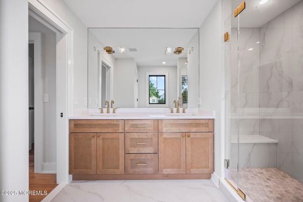 Bathroom, Dual Sink Vanities, Glass Shower, Interior, Marble, Marble Walls, Recessed Lighting