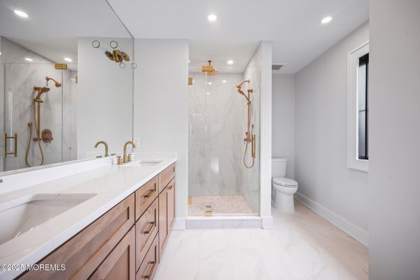 Bathroom, Dual Sink Vanities, Glass Shower, Interior, Marble, Marble Walls, Recessed Lighting