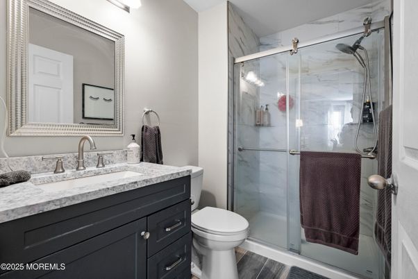 Bathroom, Glass Shower, Interior, Marble Walls, Wood Texture Flooring