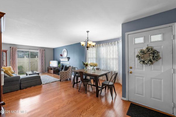 Chandelier, Dining room, Fireplace, Interior, Living room, Wood Texture Flooring
