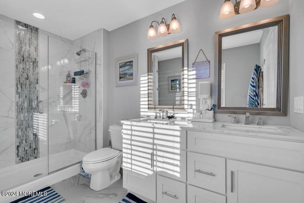 Bathroom, Dual Sink Vanities, Glass Shower, Interior, Marble, Marble Walls, Recessed Lighting